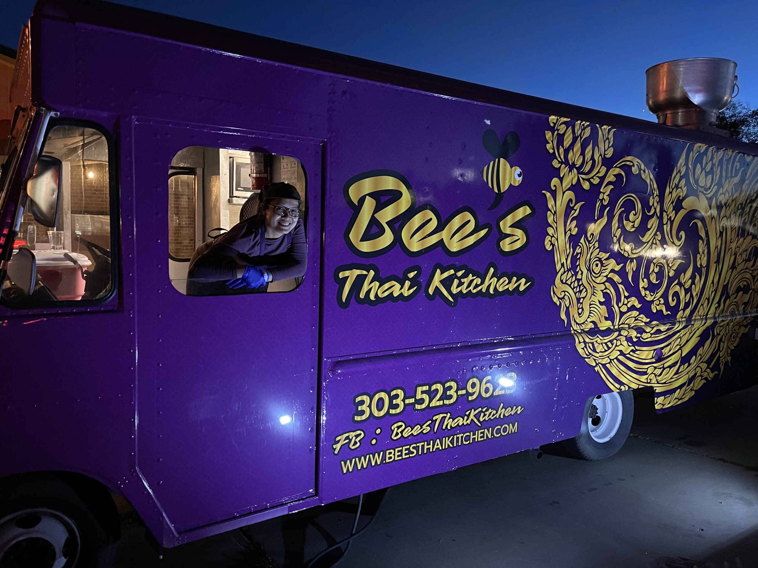 The purple Bee's Thai Kitchen food truck with its serving window open, Lafayette, Colorado