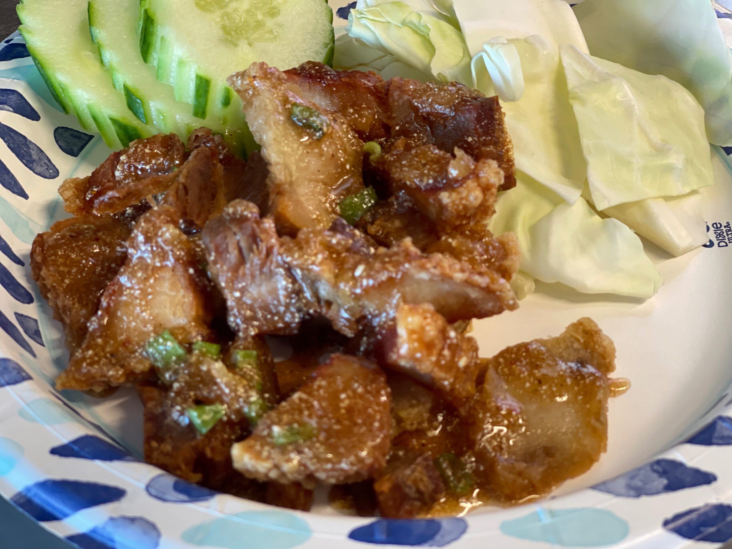 Crispy Thai pork served with cucumber and cabbage